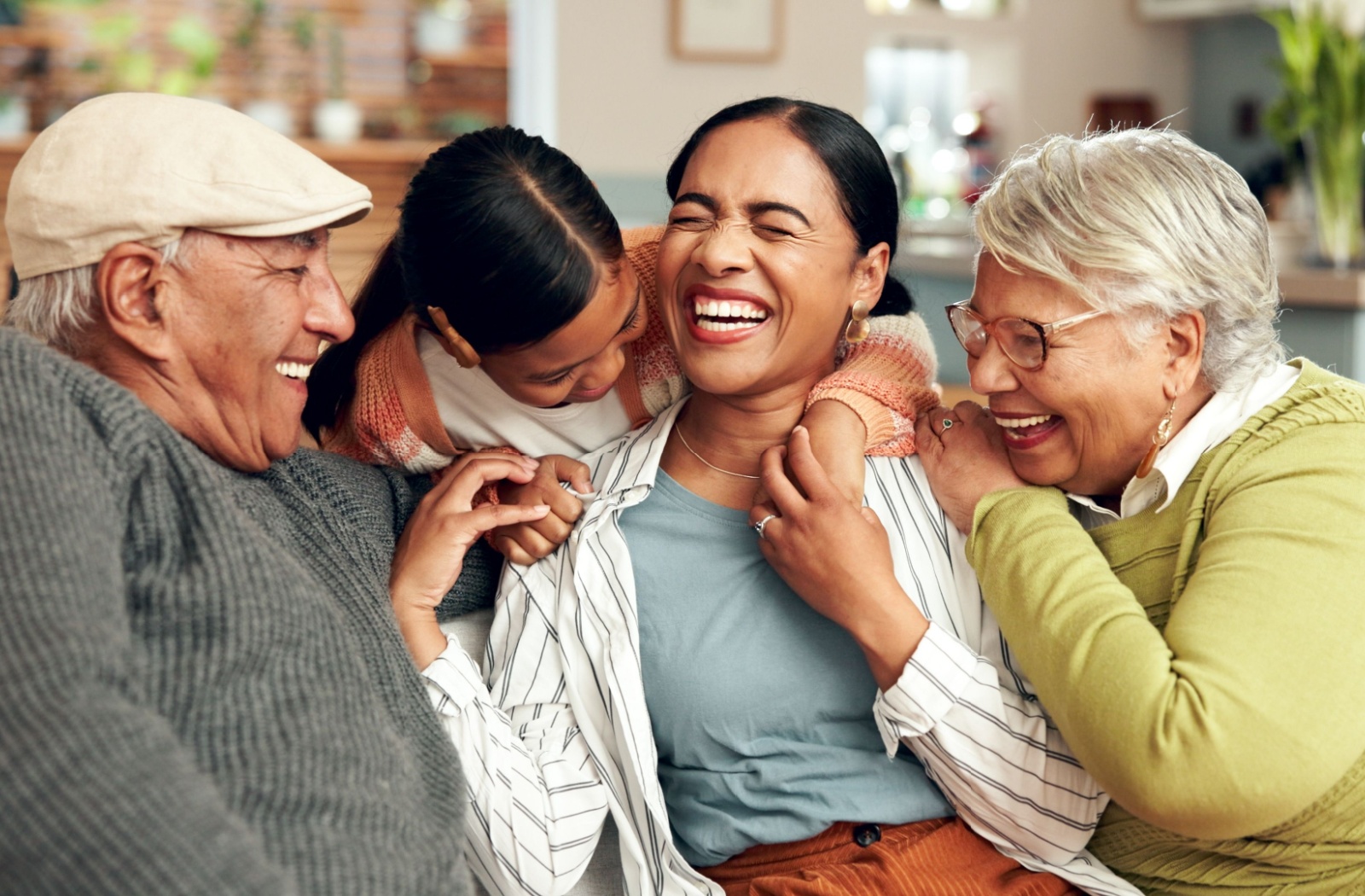 A happy family visiting their elders in memory care.